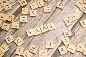 scrabble-letters-spelling-saas-on-a-wooden-tabl